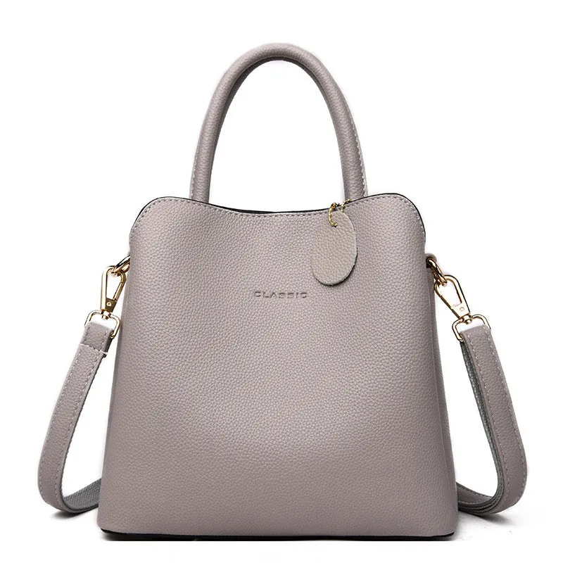 Ya Shi Mei Duo women's medium PU leather bucket bag with litchi pattern in black, soft handle and zipper closure
