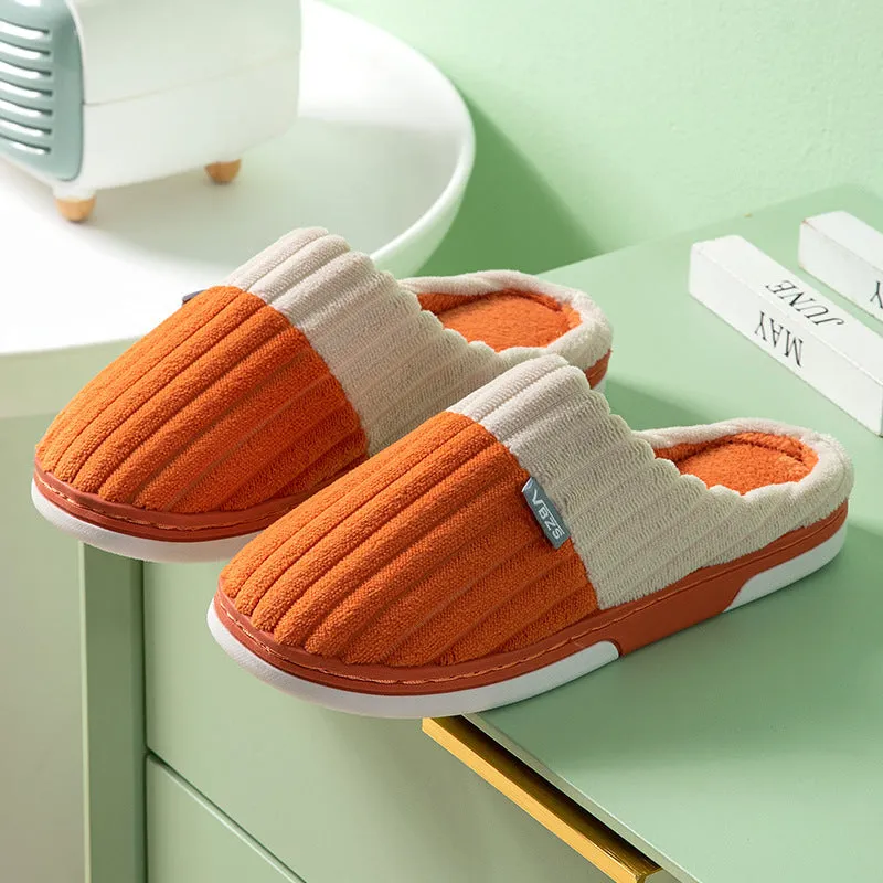 Unisex winter slippers in candy colour, suede upper, TPR sole, Baotou style, on a clean background.