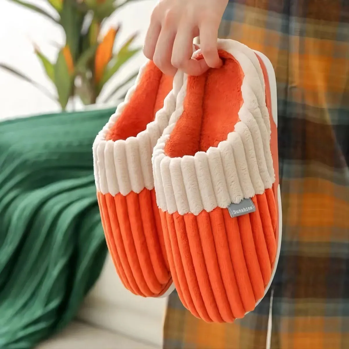 Unisex winter slippers in candy colour, suede upper, TPR sole, Baotou style, on a clean background.