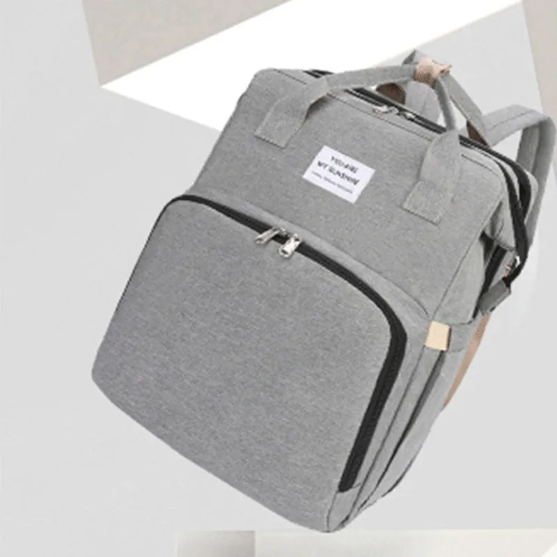 Portable folding crib mummy bag in nylon with USB interface and curved shoulder strap