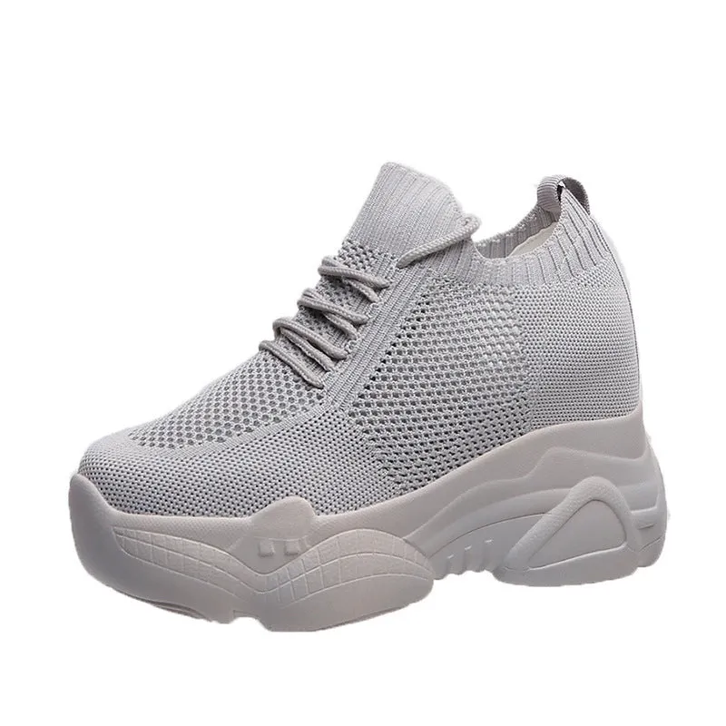 Women's white canvas low top round toe casual shoes with polyurethane sole on a neutral background