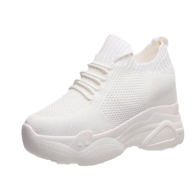 Women's white canvas low top round toe casual shoes with polyurethane sole on a neutral background