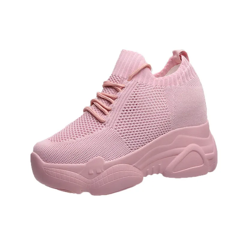 Women's white canvas low top round toe casual shoes with polyurethane sole on a neutral background