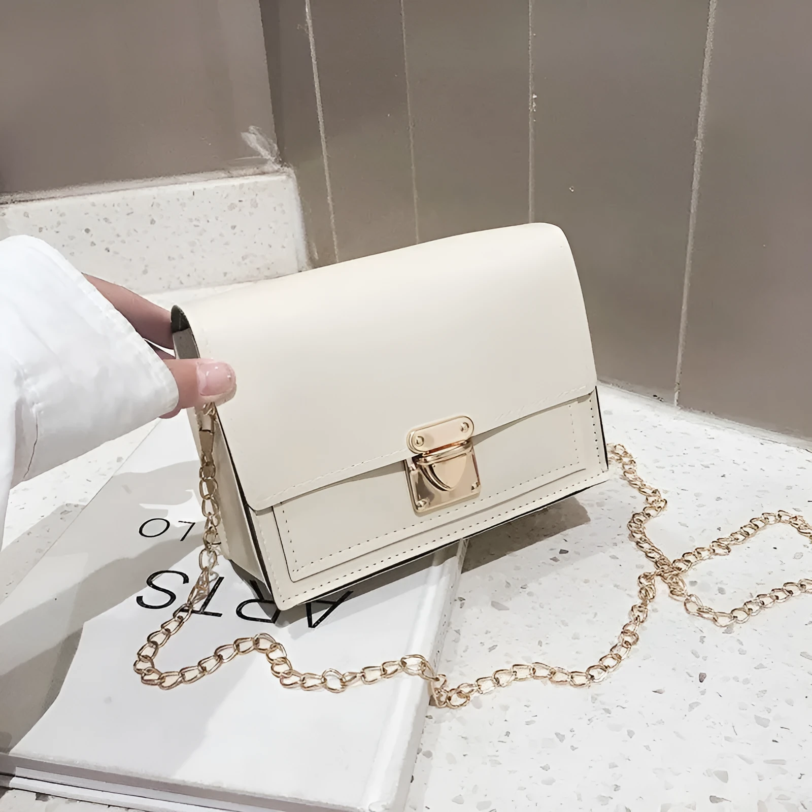 Women's PU leather small square messenger bag in beige with chain strap, 17x13x6cm.
