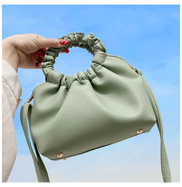 Medium one-shoulder bucket messenger bag in soft PU with fold detail and internal phone pocket