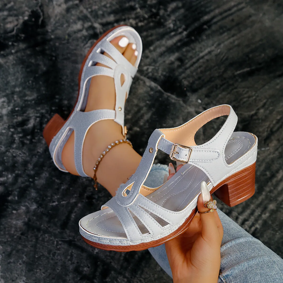 Women's black peep toe wedge platform sandals with an adjustable buckle strap on a white background.