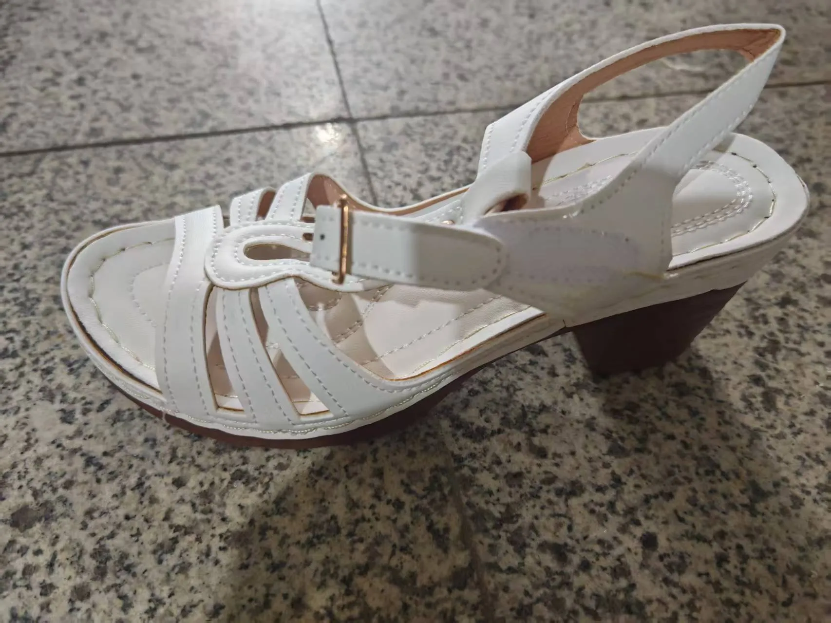 Women's black peep toe wedge platform sandals with an adjustable buckle strap on a white background.