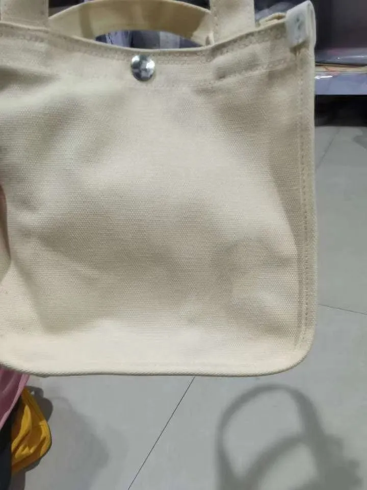 Canvas small square messenger bag for women with magnetic buckle closure in khaki colour