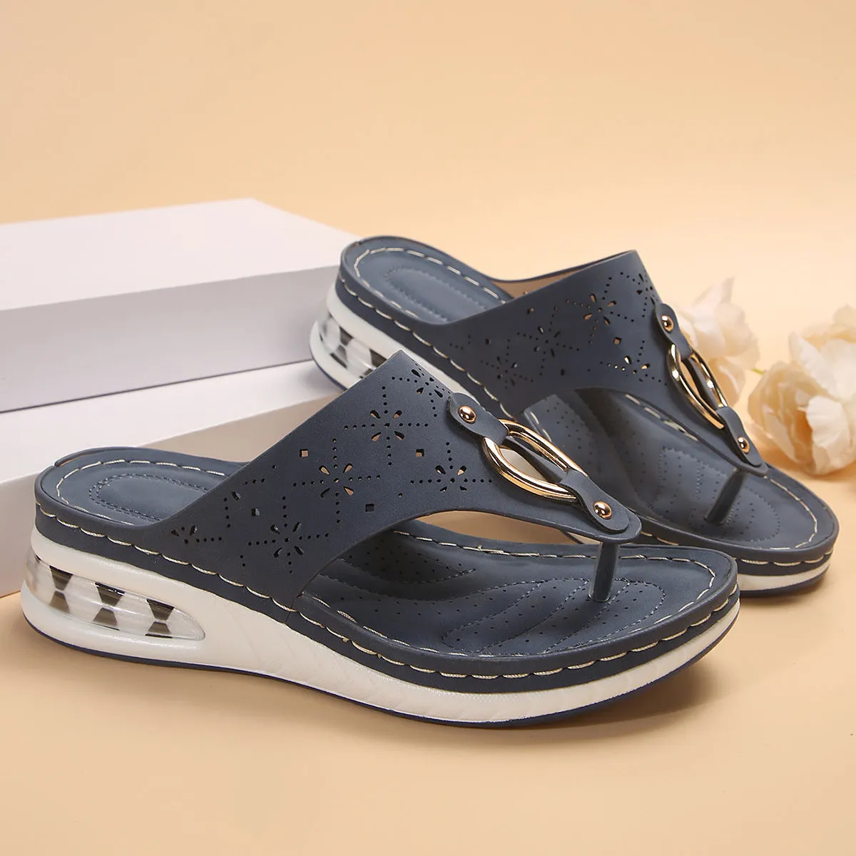 Women's air cushion wedge thong sandals with hollow metal buckle, black PU upper, rubber sole, herringbone toe