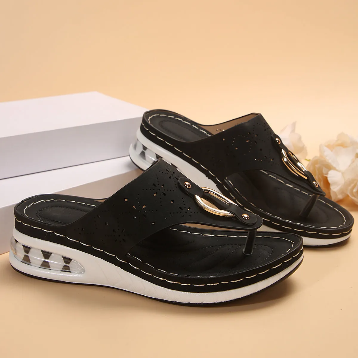 Women's air cushion wedge thong sandals with hollow metal buckle, black PU upper, rubber sole, herringbone toe