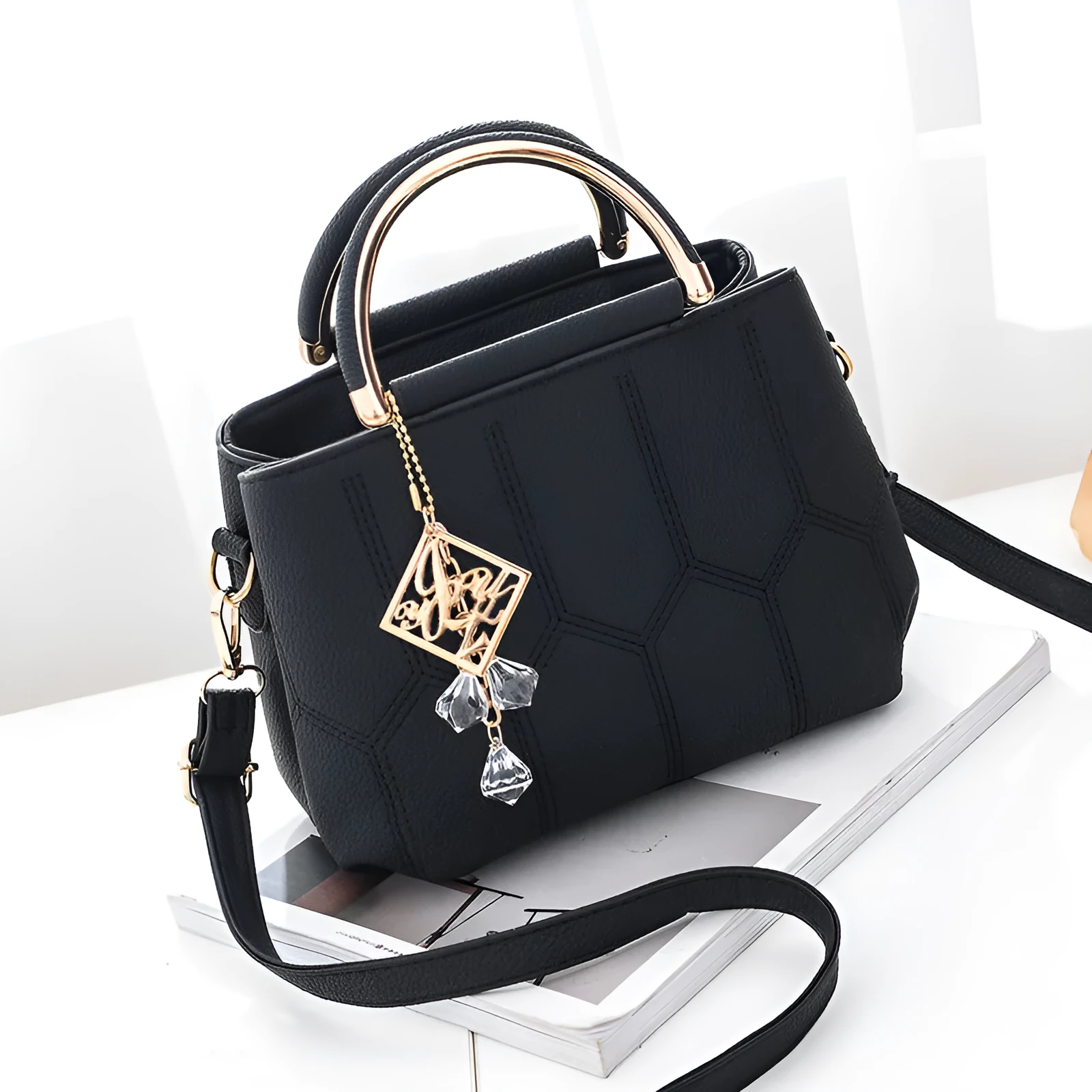 Women's polyester shoulder bag in solid colour with car seam detail and zipper closure, available in five colours