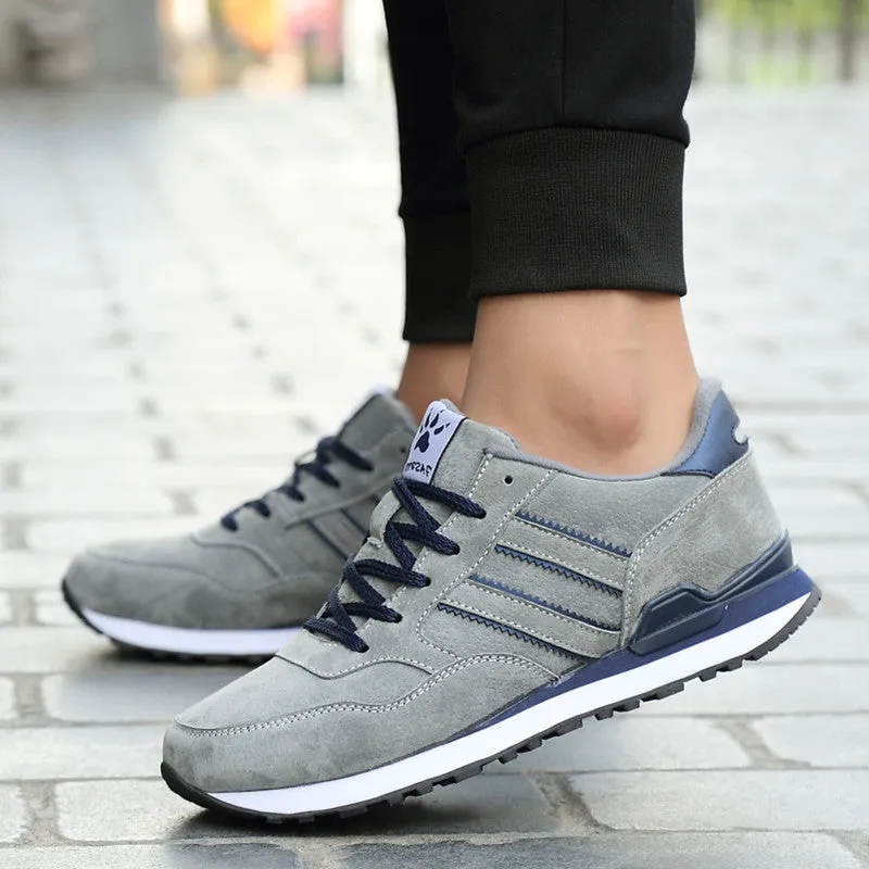 Blue leather sneakers for men with low-top design, pigskin upper, and rubber sole on a plain background
