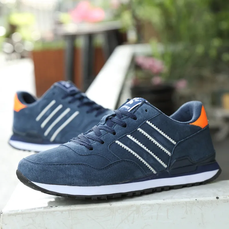 Blue leather sneakers for men with low-top design, pigskin upper, and rubber sole on a plain background