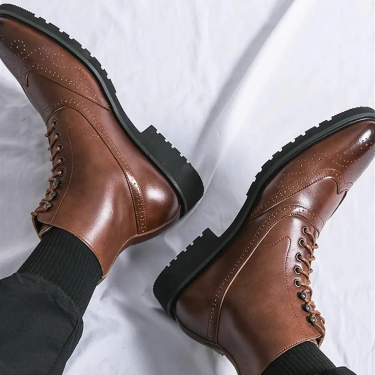 Men's mid top leather work shoes in black with thick sole and sturdy stitching