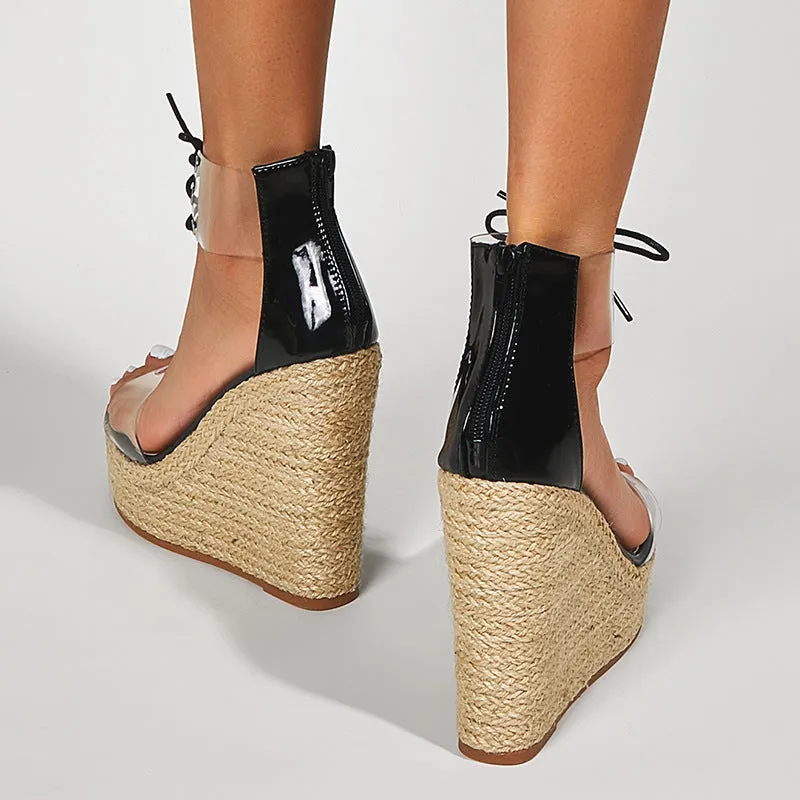 Black women's wedge sandals with hemp rope detail and a super high platform heel.