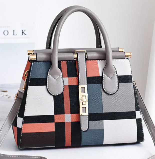 Women's large capacity PU leather Boston handbag in horizontal square shape with soft handle and belt decoration