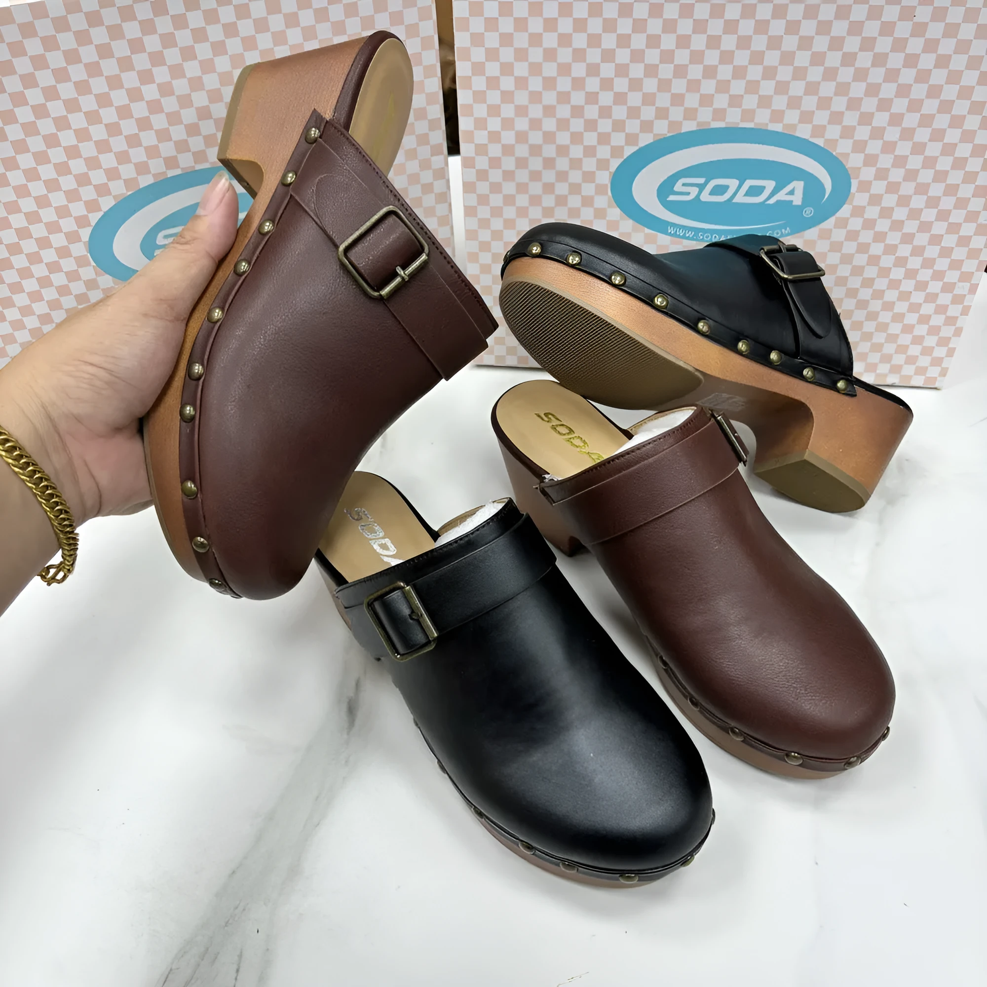 Retro-style ladies' slippers with a chunky heel, closed toe, round head, and decorative rivet details in black or dark brown.