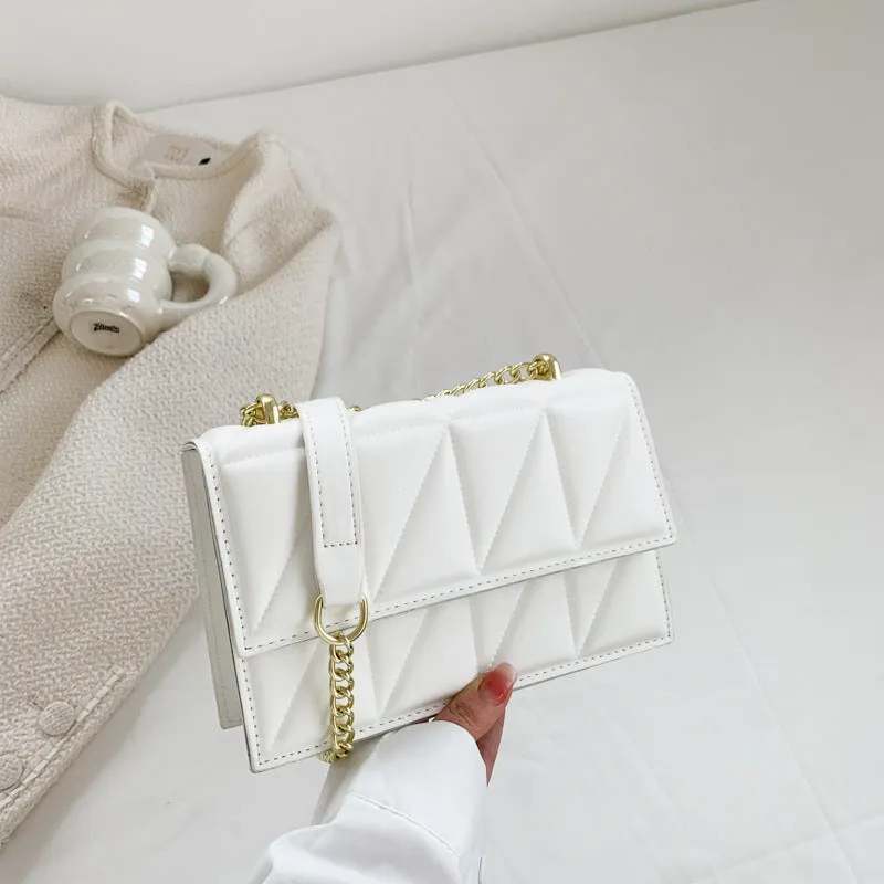Small square PU chain crossbody bag in horizontal shape with spliced detail, available in five colours.