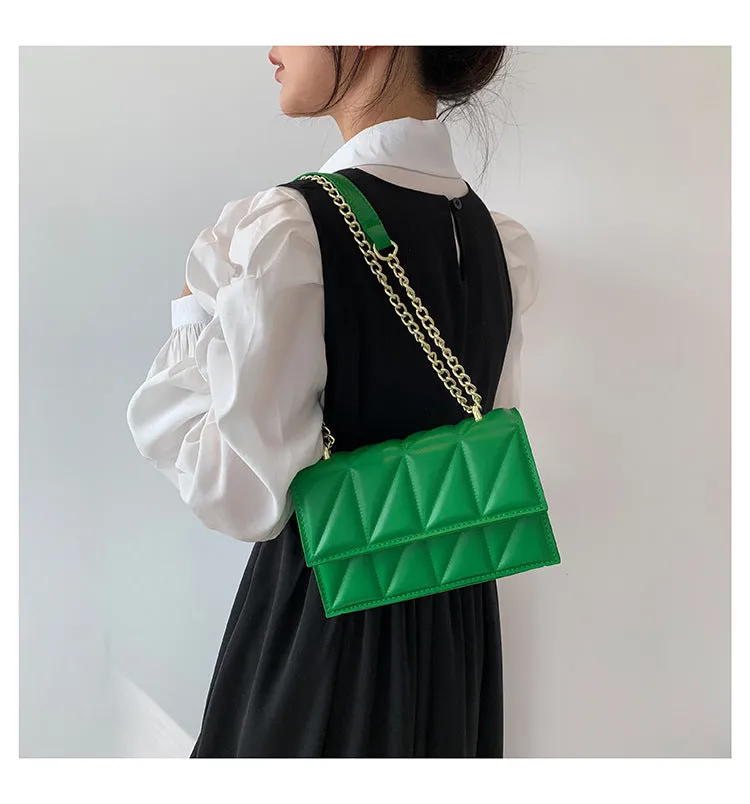 Small square PU chain crossbody bag in horizontal shape with spliced detail, available in five colours.