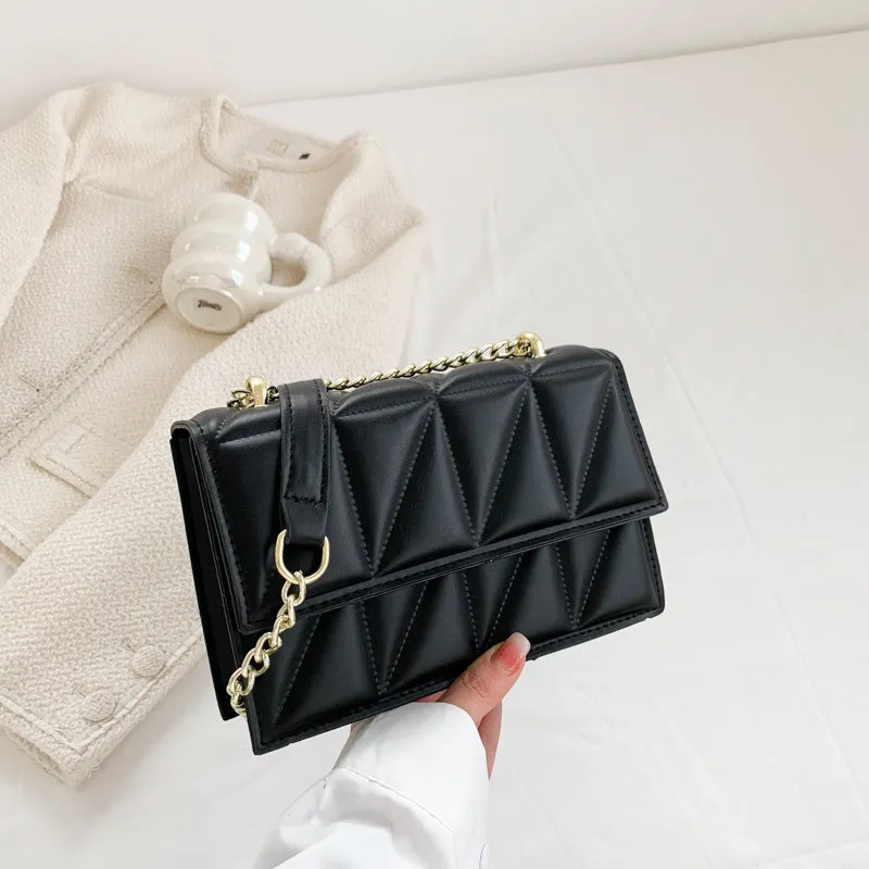 Small square PU chain crossbody bag in horizontal shape with spliced detail, available in five colours.