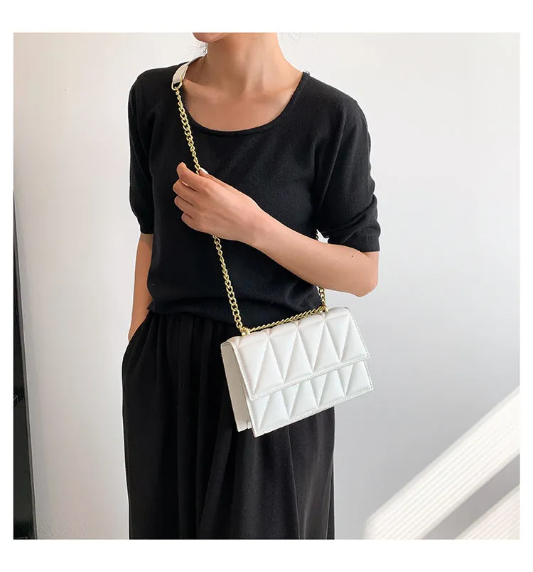 Small square PU chain crossbody bag in horizontal shape with spliced detail, available in five colours.
