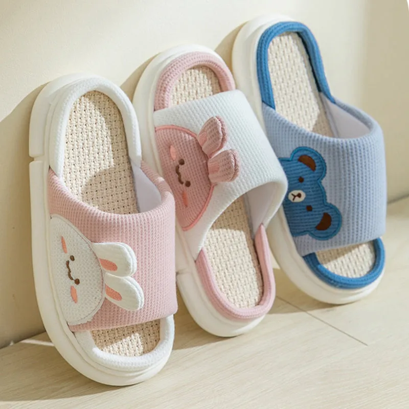 Cute linen rabbit slippers for women, white with stereoscopic rabbit design and anti-slip PVC sole, side view