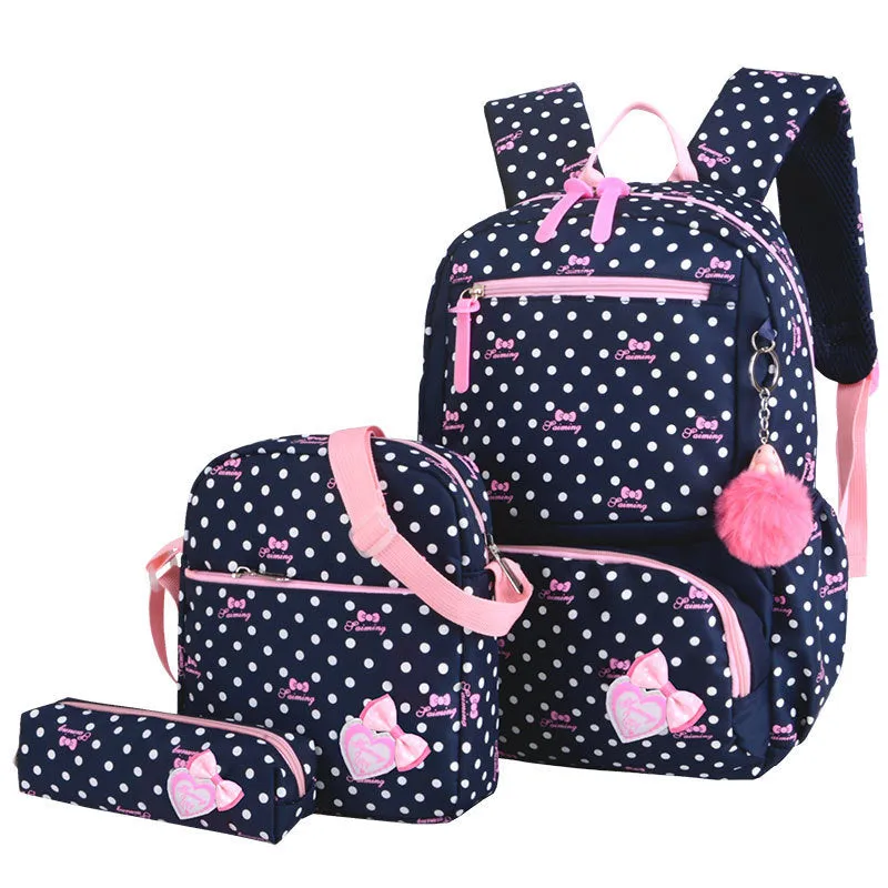 Elementary school girl Korean style cute princess backpack in light pink with polka dot bow pattern, waterproof nylon, reduced burden