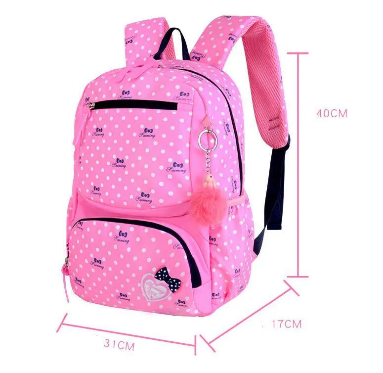 Elementary school girl Korean style cute princess backpack in light pink with polka dot bow pattern, waterproof nylon, reduced burden