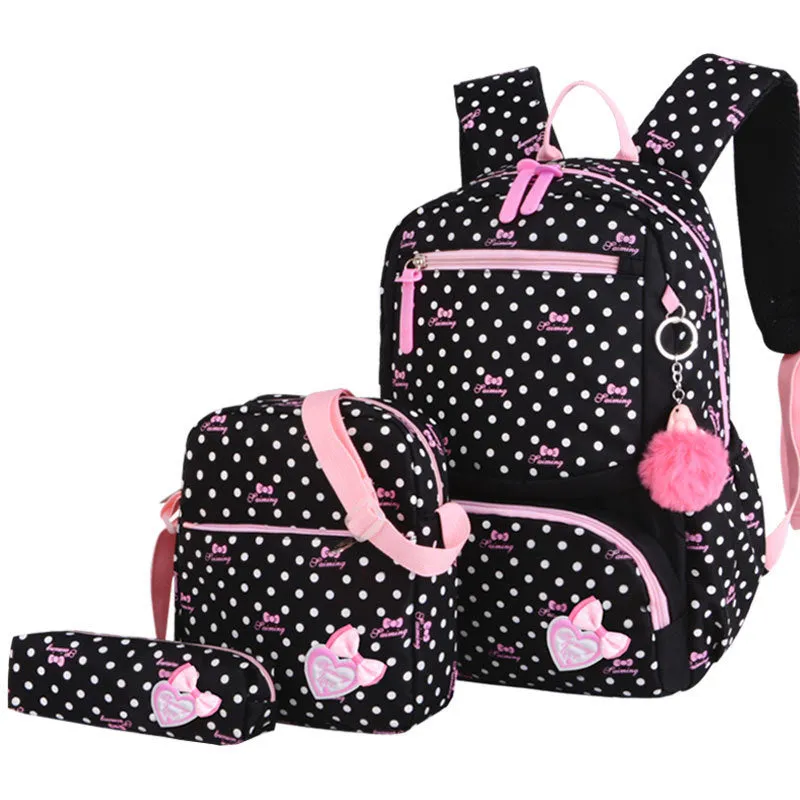 Elementary school girl Korean style cute princess backpack in light pink with polka dot bow pattern, waterproof nylon, reduced burden