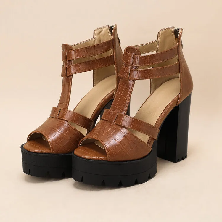 A pair of black platform high heel sandals with a back zipper and round toe on a rubber sole.