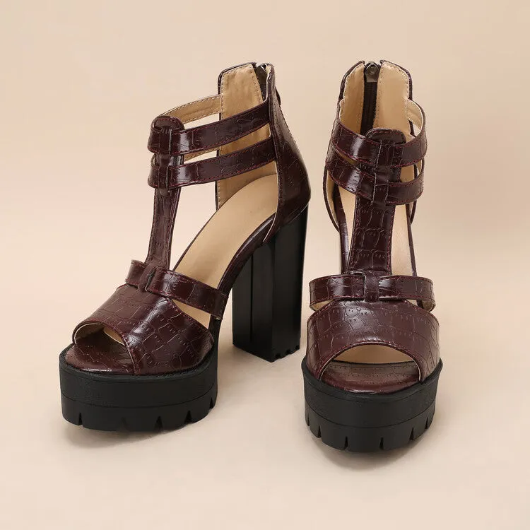 A pair of black platform high heel sandals with a back zipper and round toe on a rubber sole.