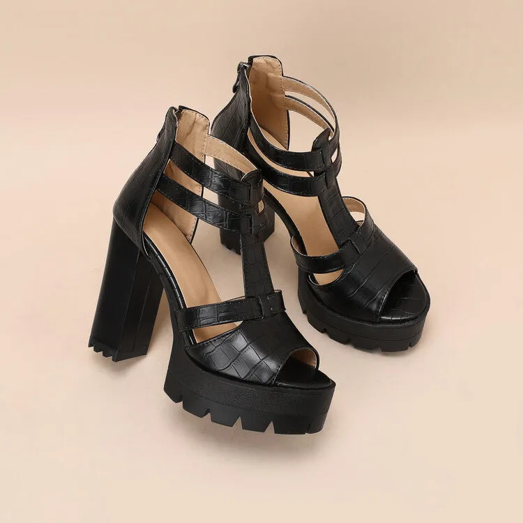 A pair of black platform high heel sandals with a back zipper and round toe on a rubber sole.