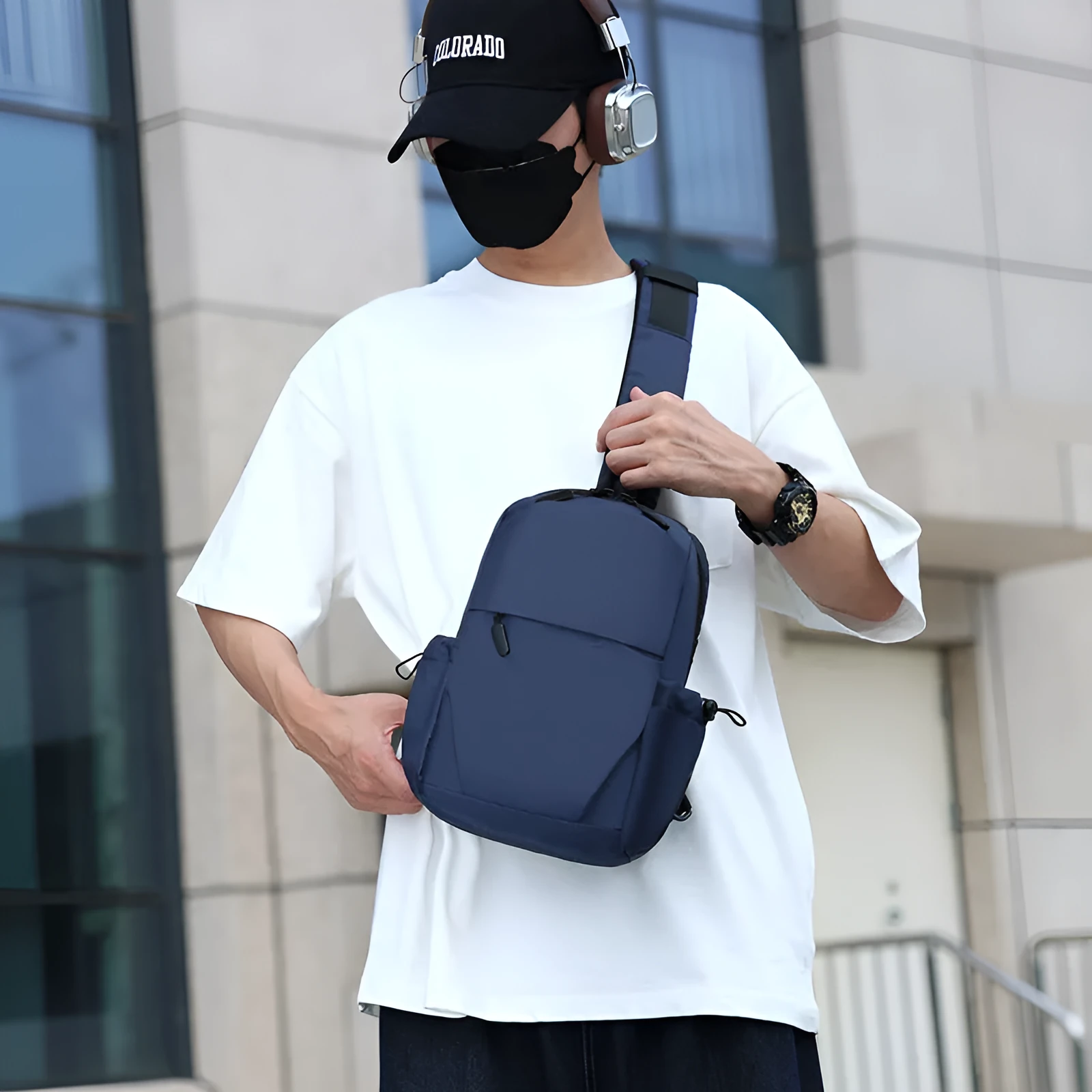 Men's grey waterproof chest bag showing front compartment and shoulder strap