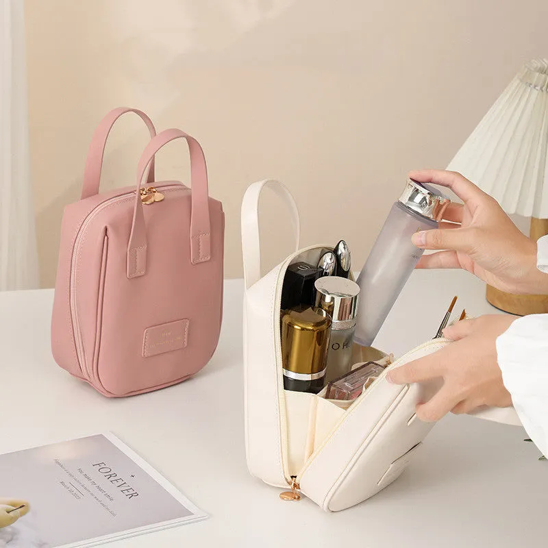 Handle-top cosmetic bag shell-shaped design in cream white with high capacity storage for travel and home use