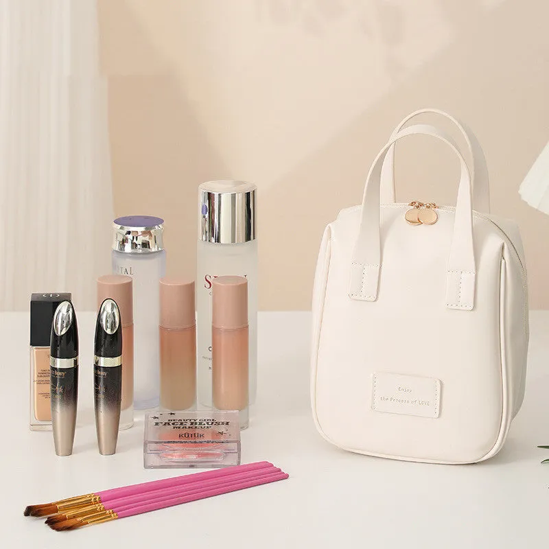 Handle-top cosmetic bag shell-shaped design in cream white with high capacity storage for travel and home use