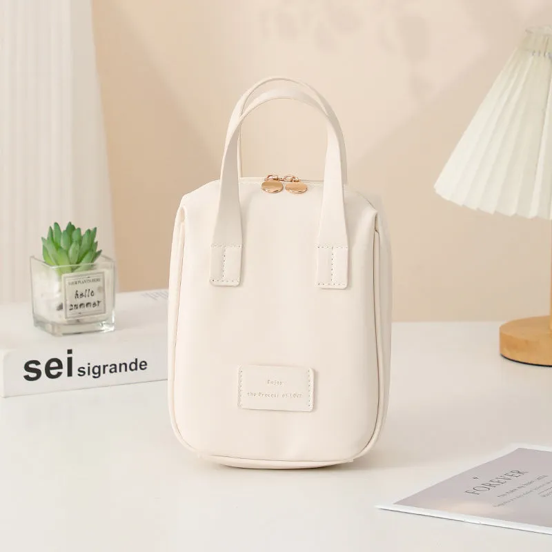 Handle-top cosmetic bag shell-shaped design in cream white with high capacity storage for travel and home use