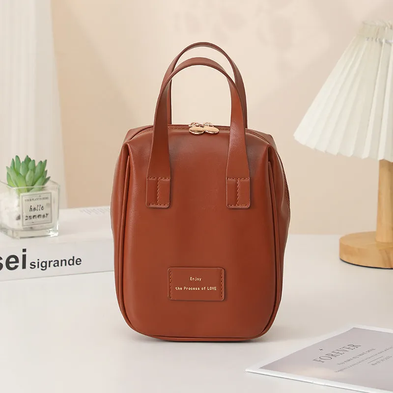 Handle-top cosmetic bag shell-shaped design in cream white with high capacity storage for travel and home use