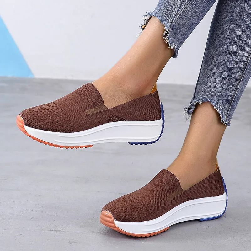 Women's lightweight mesh running shoes in white with composite sole, side view