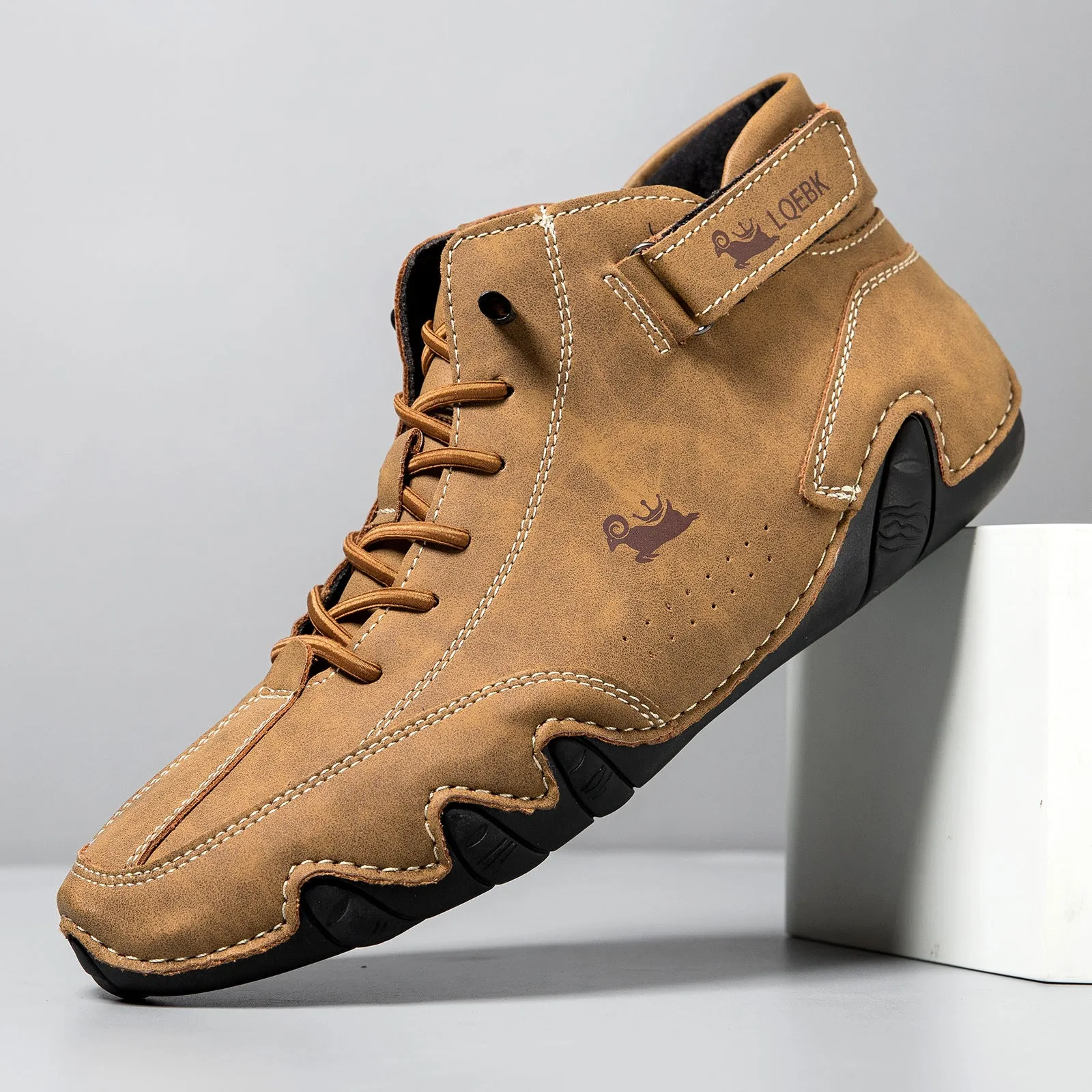 Men's brown high-top Martin boot with lace-up front, round toe, and flat rubber sole on a white background