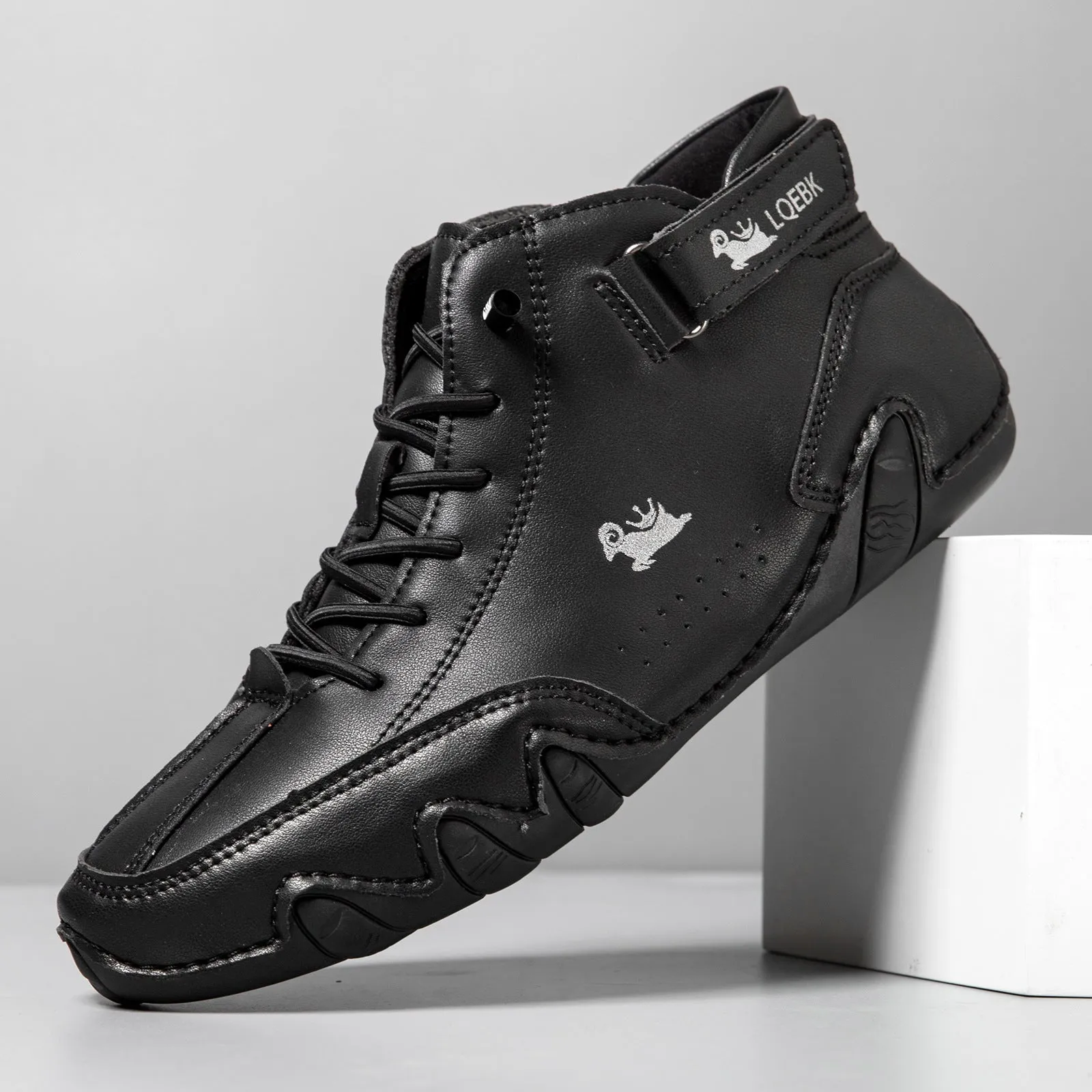 Men's brown high-top Martin boot with lace-up front, round toe, and flat rubber sole on a white background