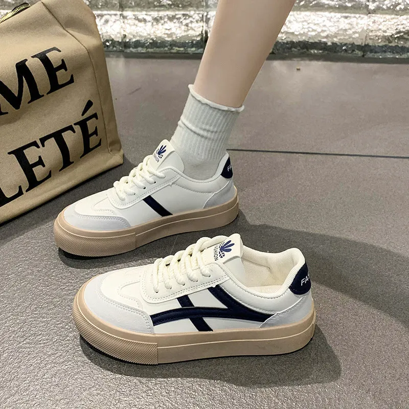 Brown and blue low-top casual lace-up shoes with a round toe and flat rubber sole.