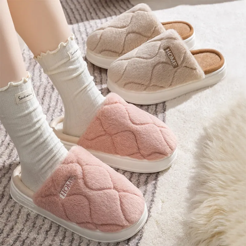 Plush indoor slippers in light gray with car stitching detail on the upper and PVC sole