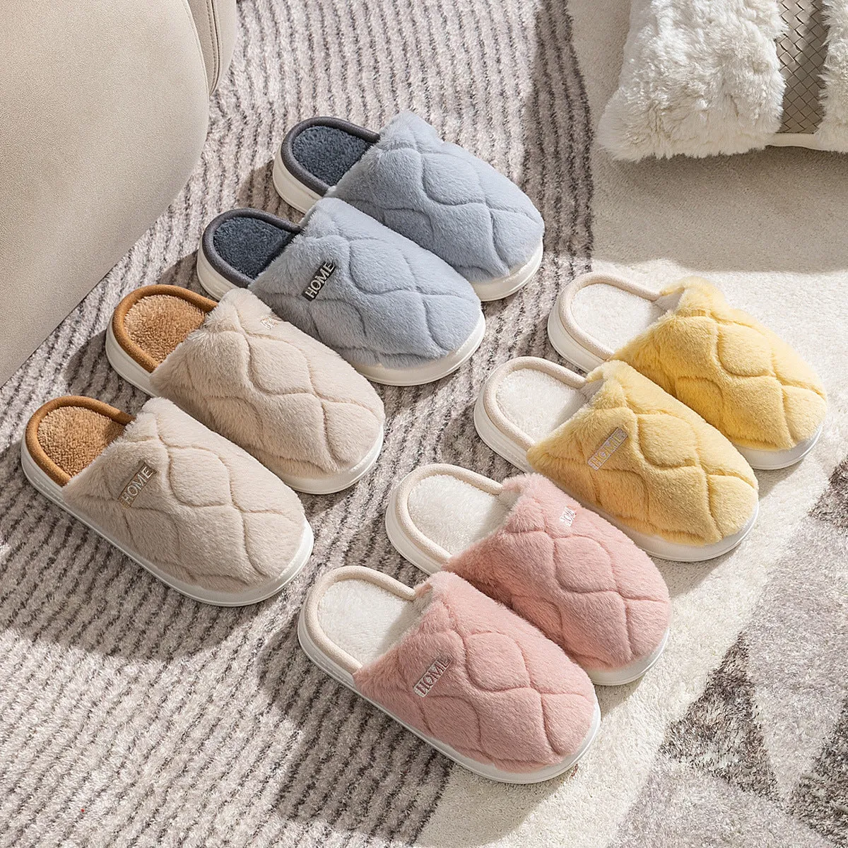 Plush indoor slippers in light gray with car stitching detail on the upper and PVC sole