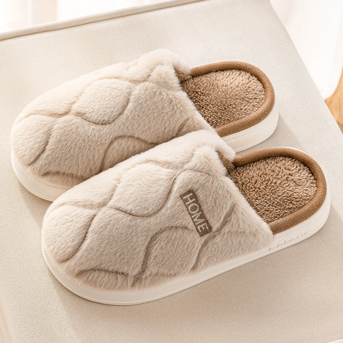 Plush indoor slippers in light gray with car stitching detail on the upper and PVC sole