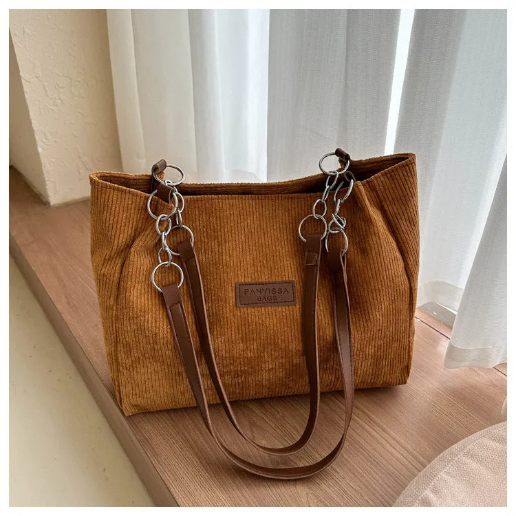 Corduroy women's tote handbag with one-shoulder strap and three-dimensional pocket in horizontal square shape