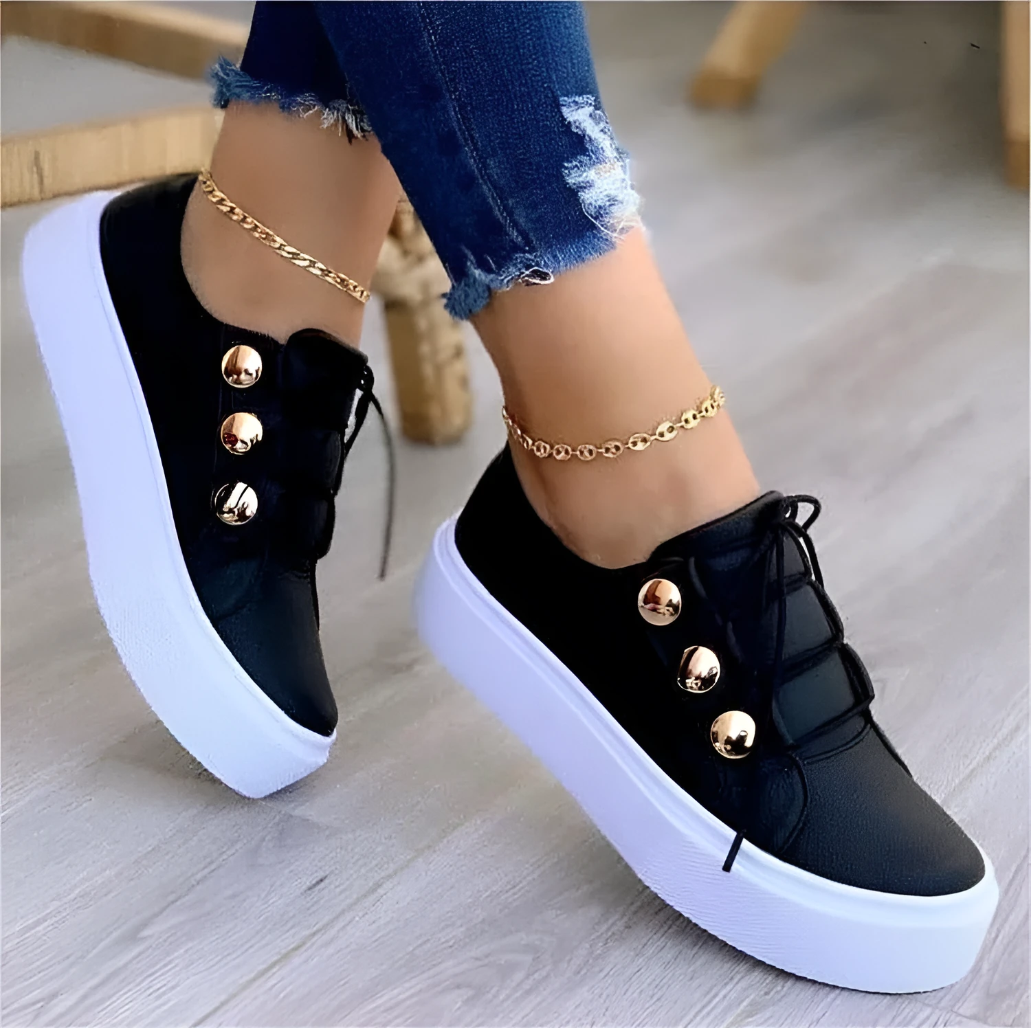 Women's lace-up rivet flats sneakers in white with round toe and front tie closure on polyurethane sole
