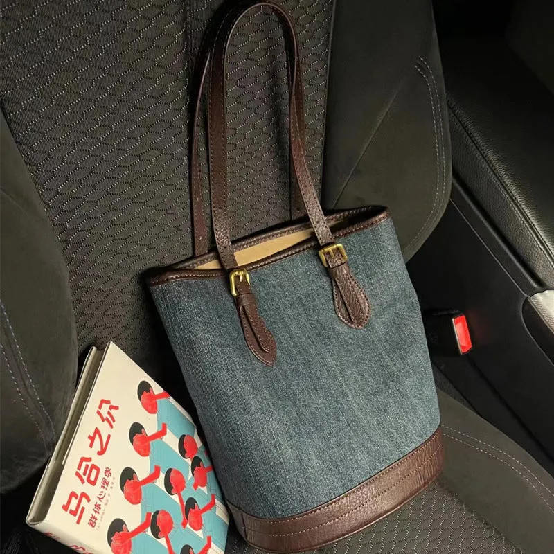 Denim patchwork handbag with retro bucket design showing dimensions and one-shoulder strap