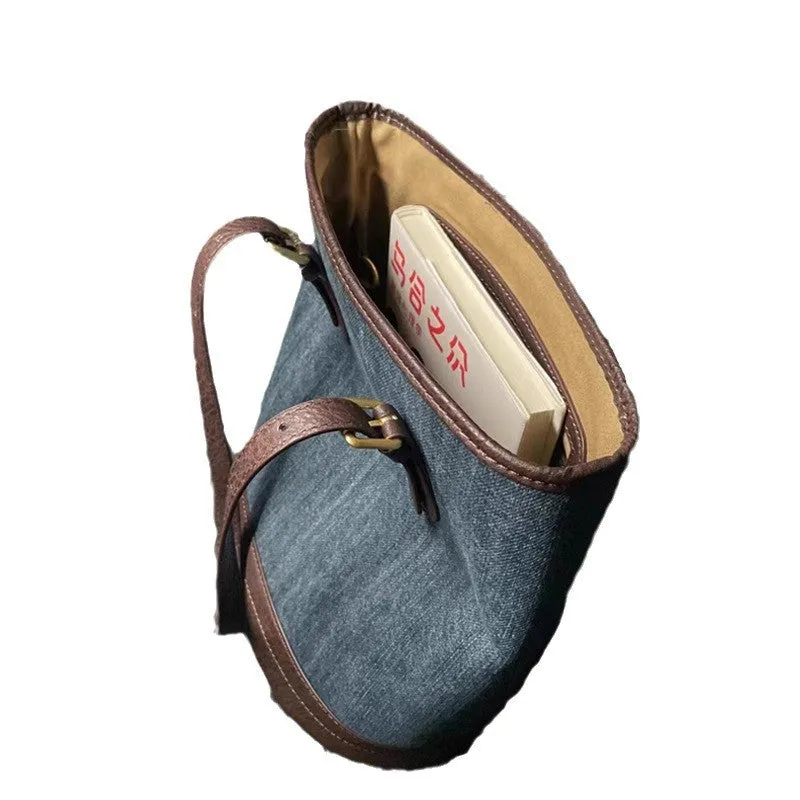 Denim patchwork handbag with retro bucket design showing dimensions and one-shoulder strap