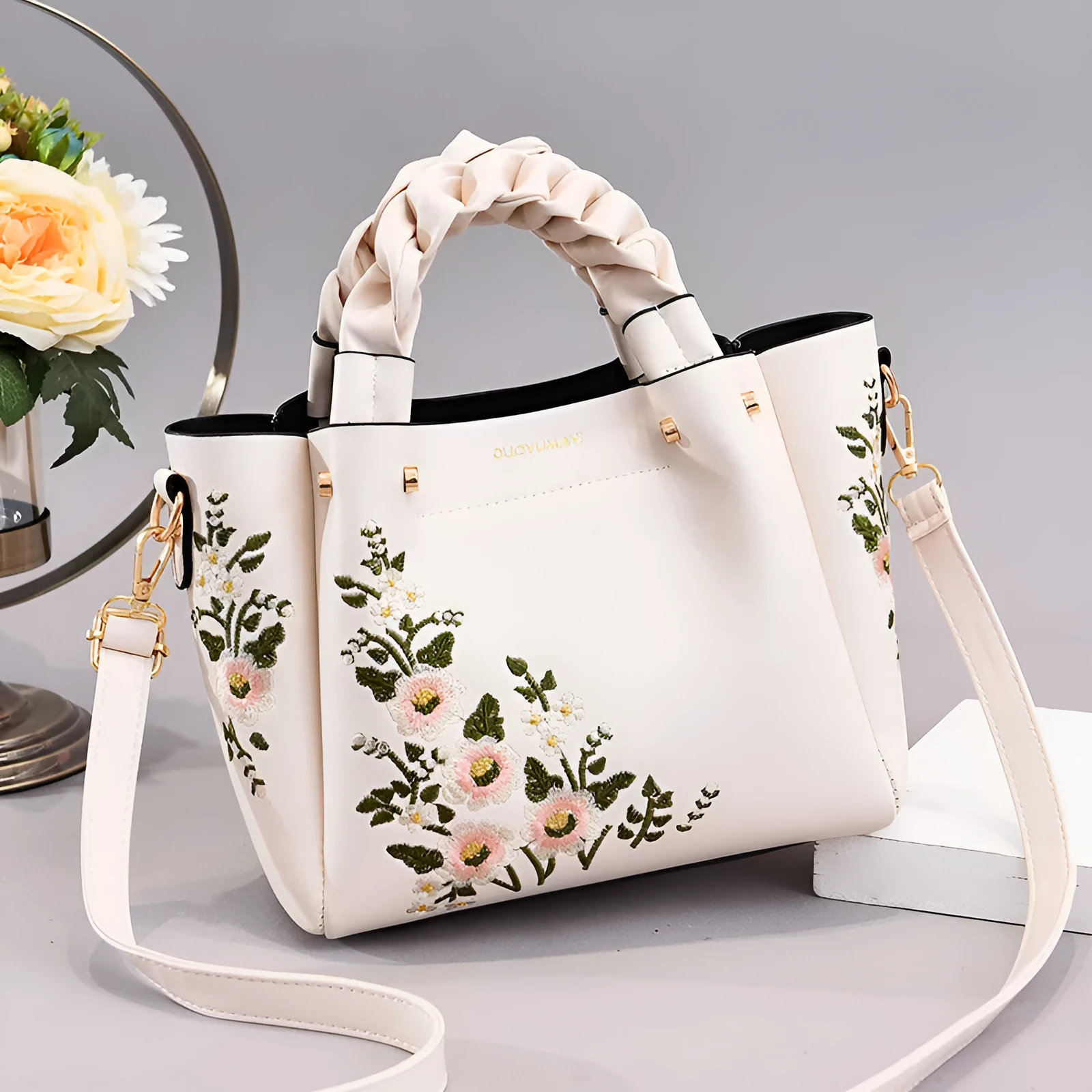 Medium PU leather drawstring tote bag for women in khaki, with shoulder strap and car stitching detail