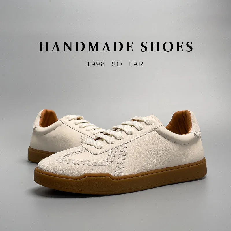 Men's beige genuine leather low-cut sneakers with white lace-up front and rubber sole on neutral background